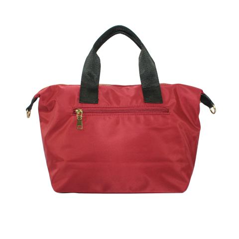 Look nylon material is adorned with gold hardware, the color goes with black and red, an exterior distinctive zipped pocket detail on front, what a simple and stylish bag!