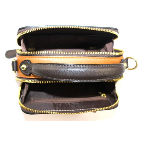 The little shoulder bag comes with adjustable shoulder strap and gold tone hardware, two both ways zips, meanwhile, a signature gold tone ring embellishment on front.