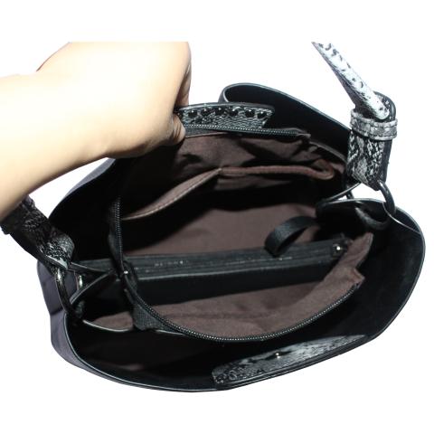 The stylish black handbag, featuring single handle, lock closure and distinctive design detail on front. And detachable adjustable shoulder strap.